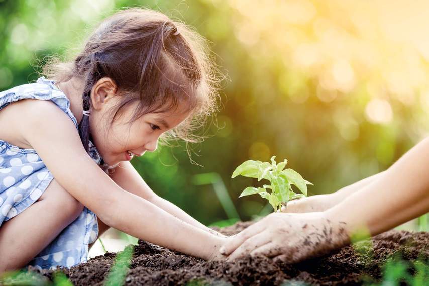 little girl gardening