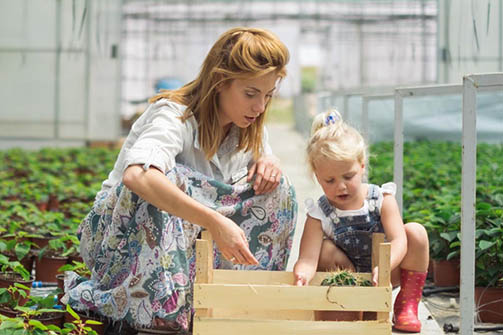 Woman and child gardening