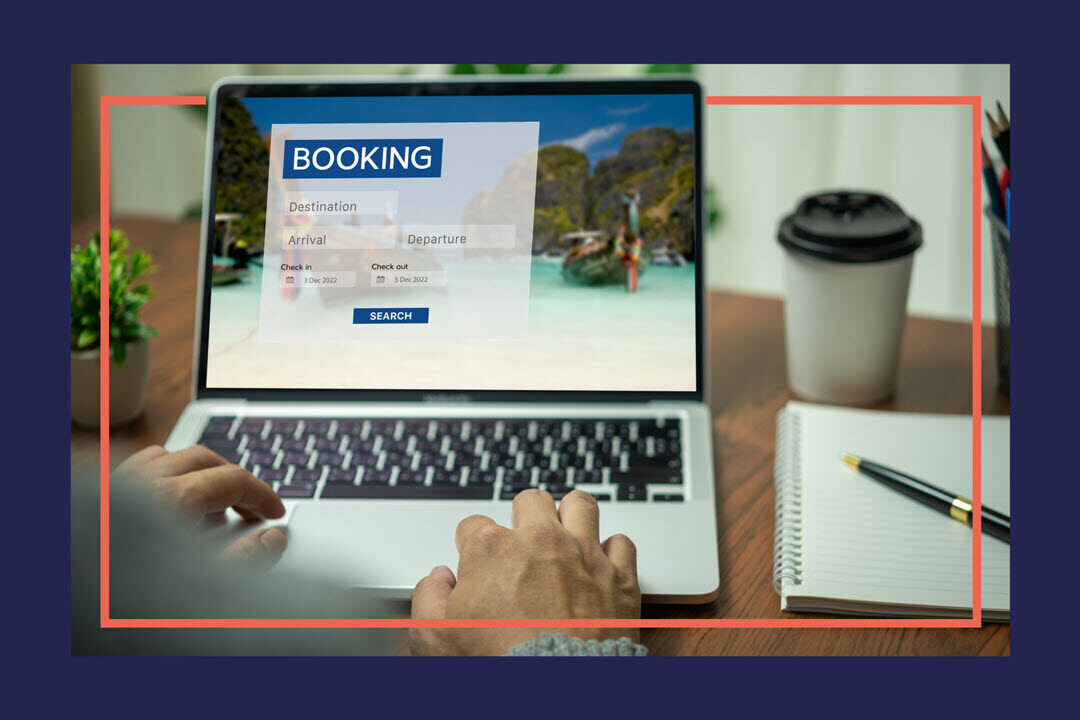 A laptop showing what appears to be a holiday booking website.