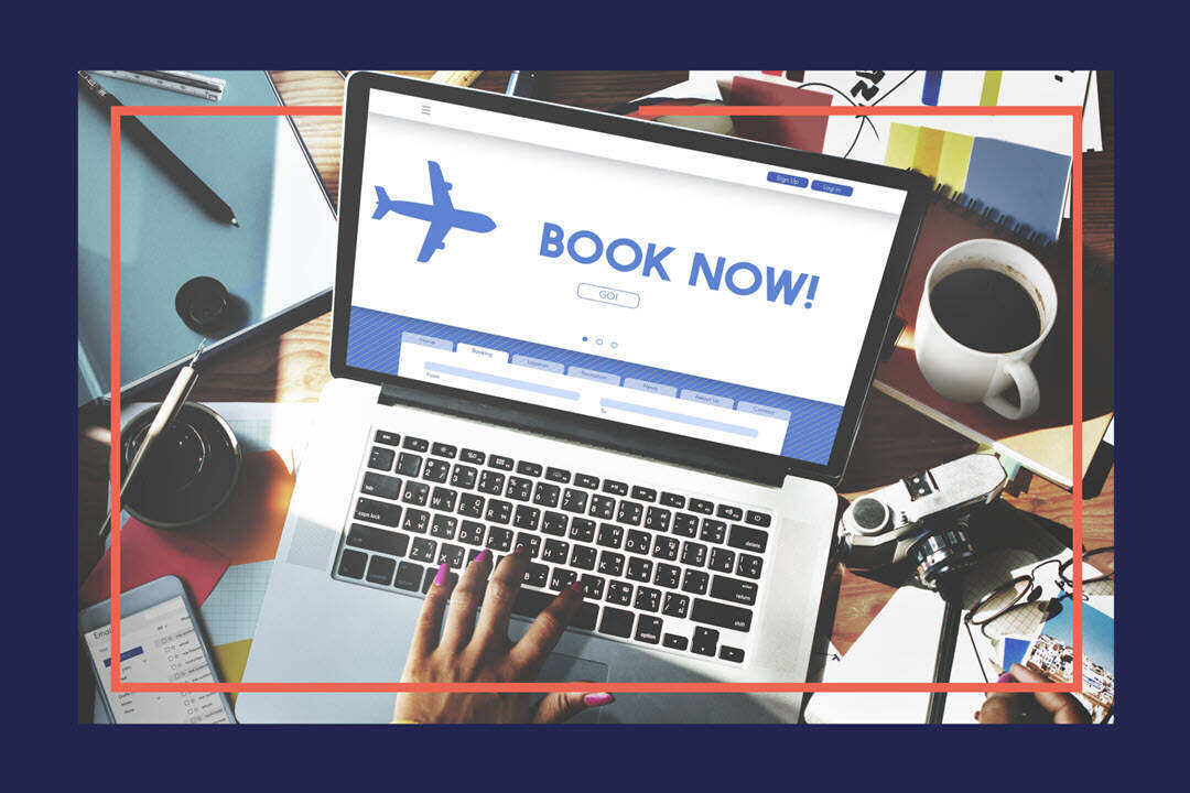 A laptop showing what appears to be a holiday booking website.