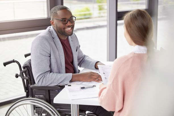 Man in a wheelchair smiling